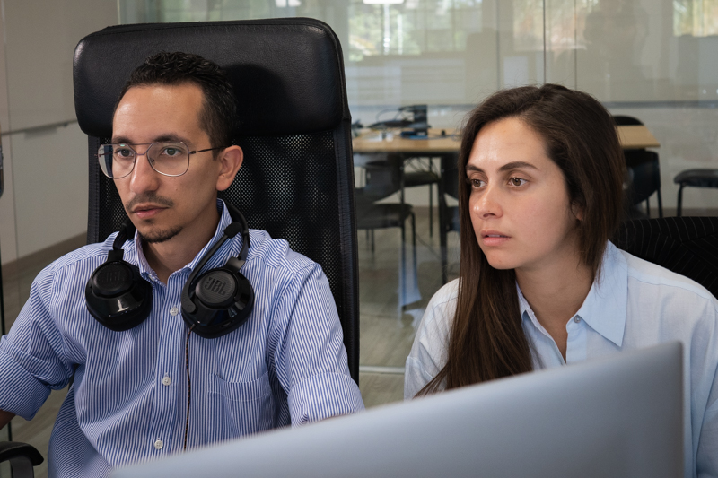 Optimanova digital marketing team members working in the office